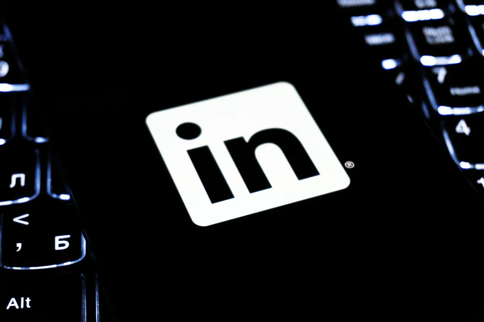 LinkedIn logo key on a dark backlit keyboard